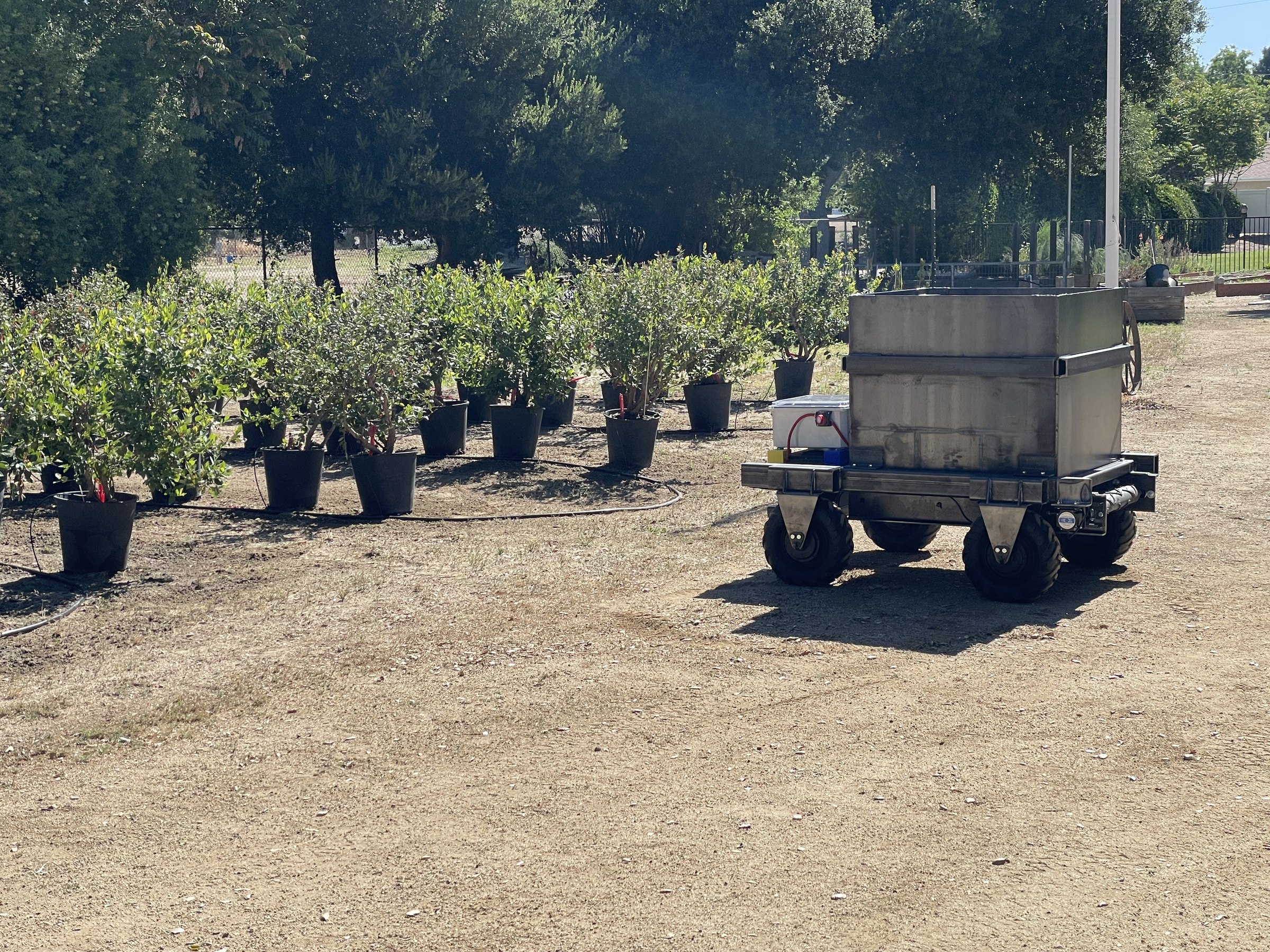 Remote-controlled compost spreader used in agricultural field instruction